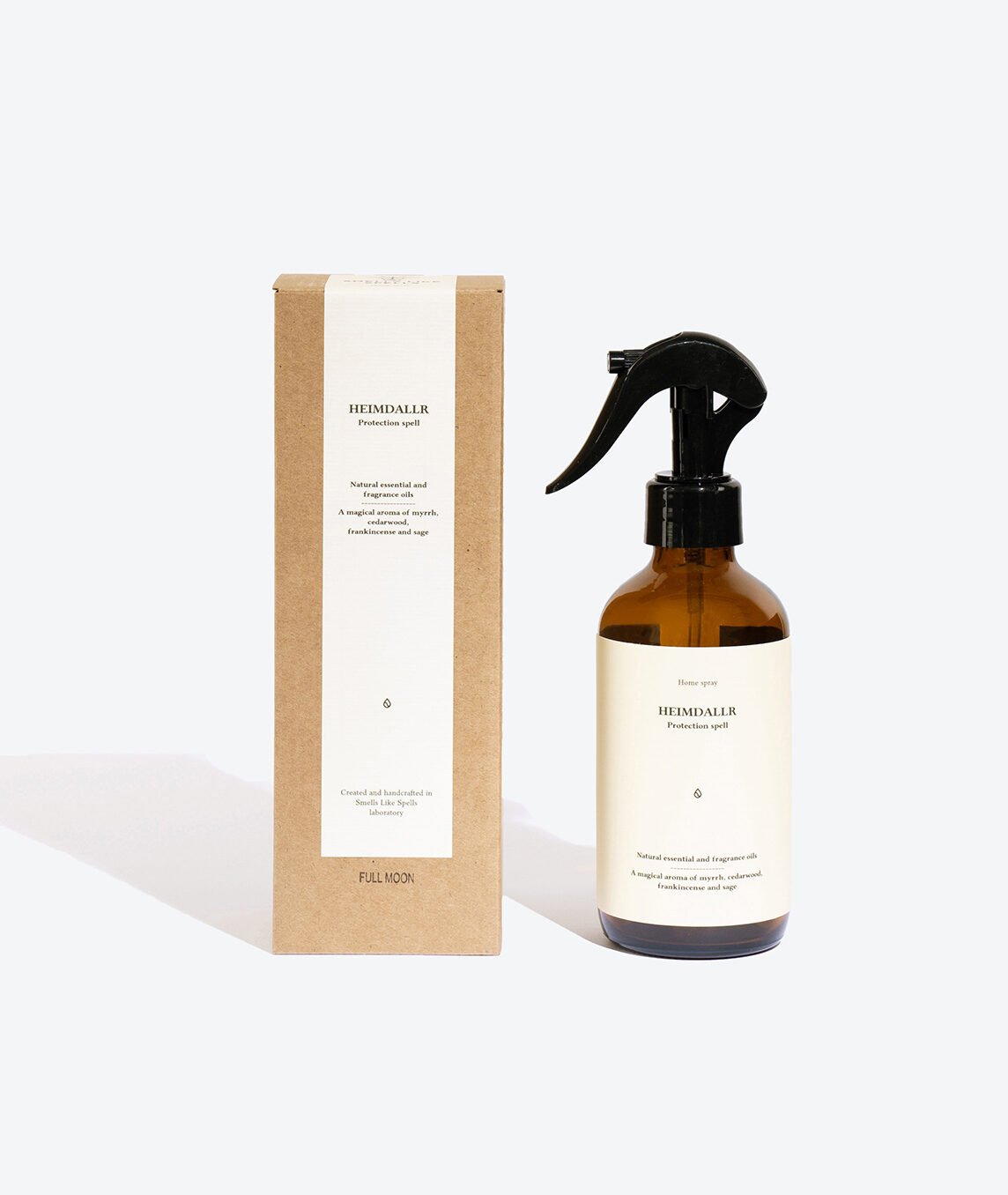 2. Smells Like Spells Heimdallr home spray with packaging, featuring amber bottle and recyclable box, studio setting