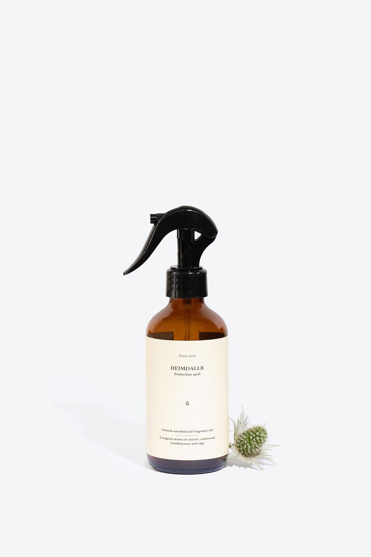 1. Smells Like Spells Heimdallr perfumed home spray in amber bottle with black spray nozzle, studio setting