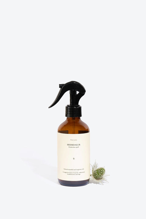 1. Smells Like Spells Heimdallr perfumed home spray in amber bottle with black spray nozzle, studio setting