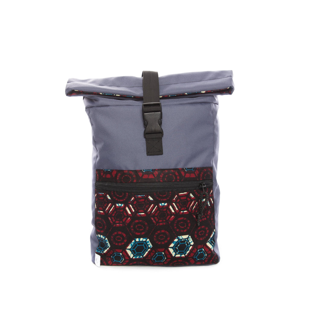 1. Drinbags HEXAGON waterproof backpack in blue with hexagon pattern, front view showing zippered pocket and roll-top closure