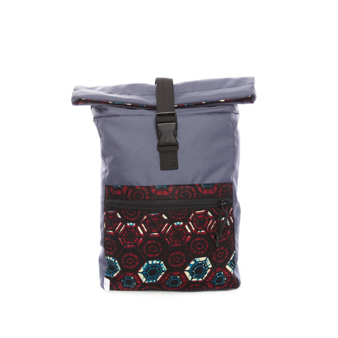 1. Drinbags HEXAGON waterproof backpack in blue with hexagon pattern, front view showing zippered pocket and roll-top closure