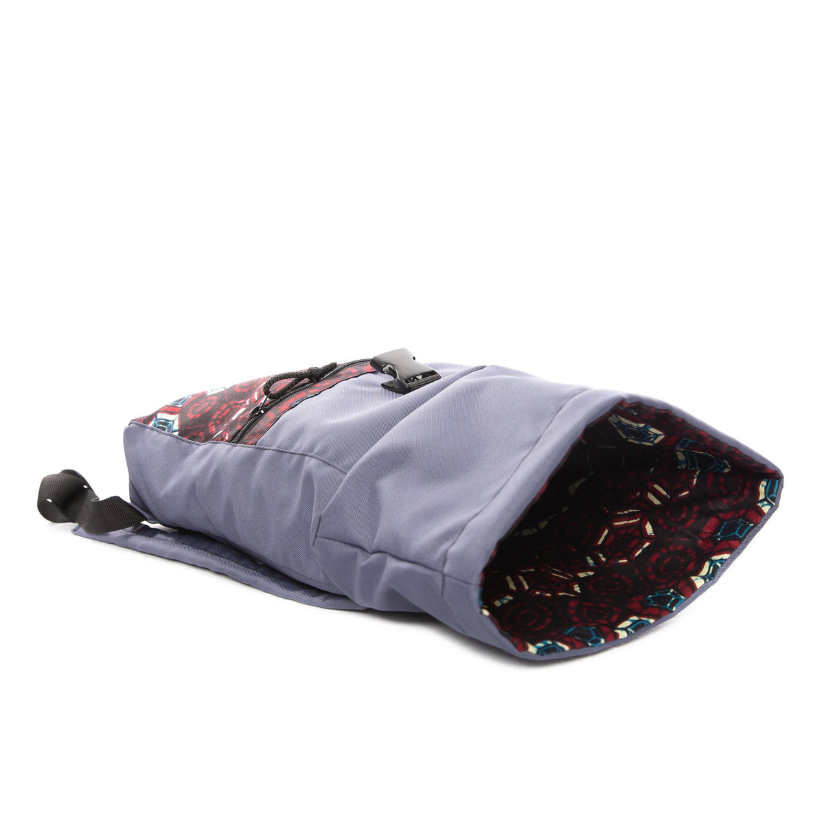 3. Side view of Drinbags HEXAGON waterproof backpack in blue, showing open roll-top and interior pattern