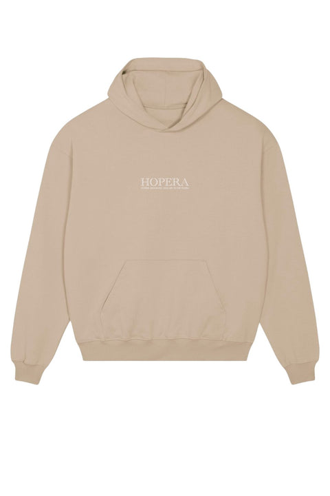 3. Front view of Hopera women's oversized beige hoodie with kangaroo pocket and brand logo, shown in studio