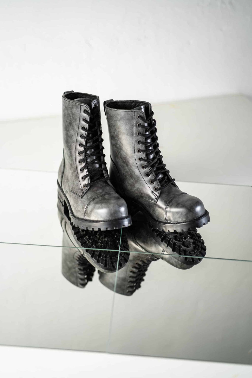 5. Front view of Samelin 511 Gray boots on reflective surface, highlighting lace-up design and leather material