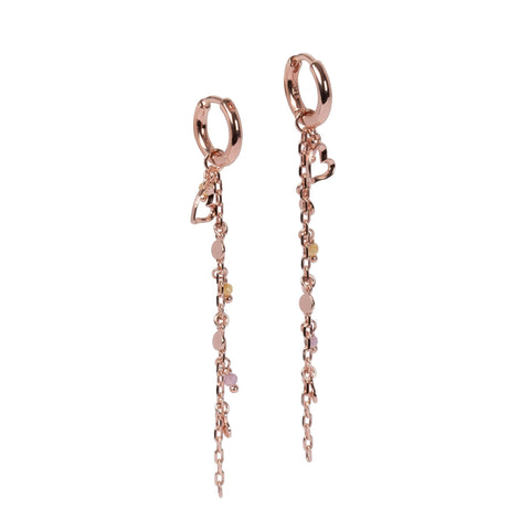 1. MyaMoon Helena♡ earrings in rose gold with detachable pendant, featuring a 6 cm chain adorned with a heart, tiny pearls, and beads, shown in studio setting