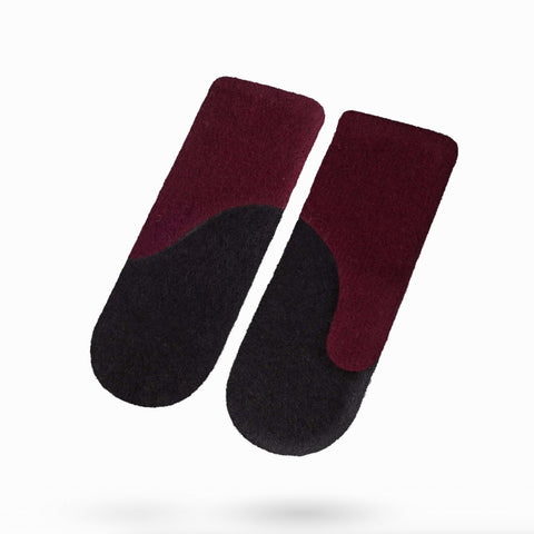 1. Women's felted wool mittens in bordeaux and black by HERTTA, shown in studio setting