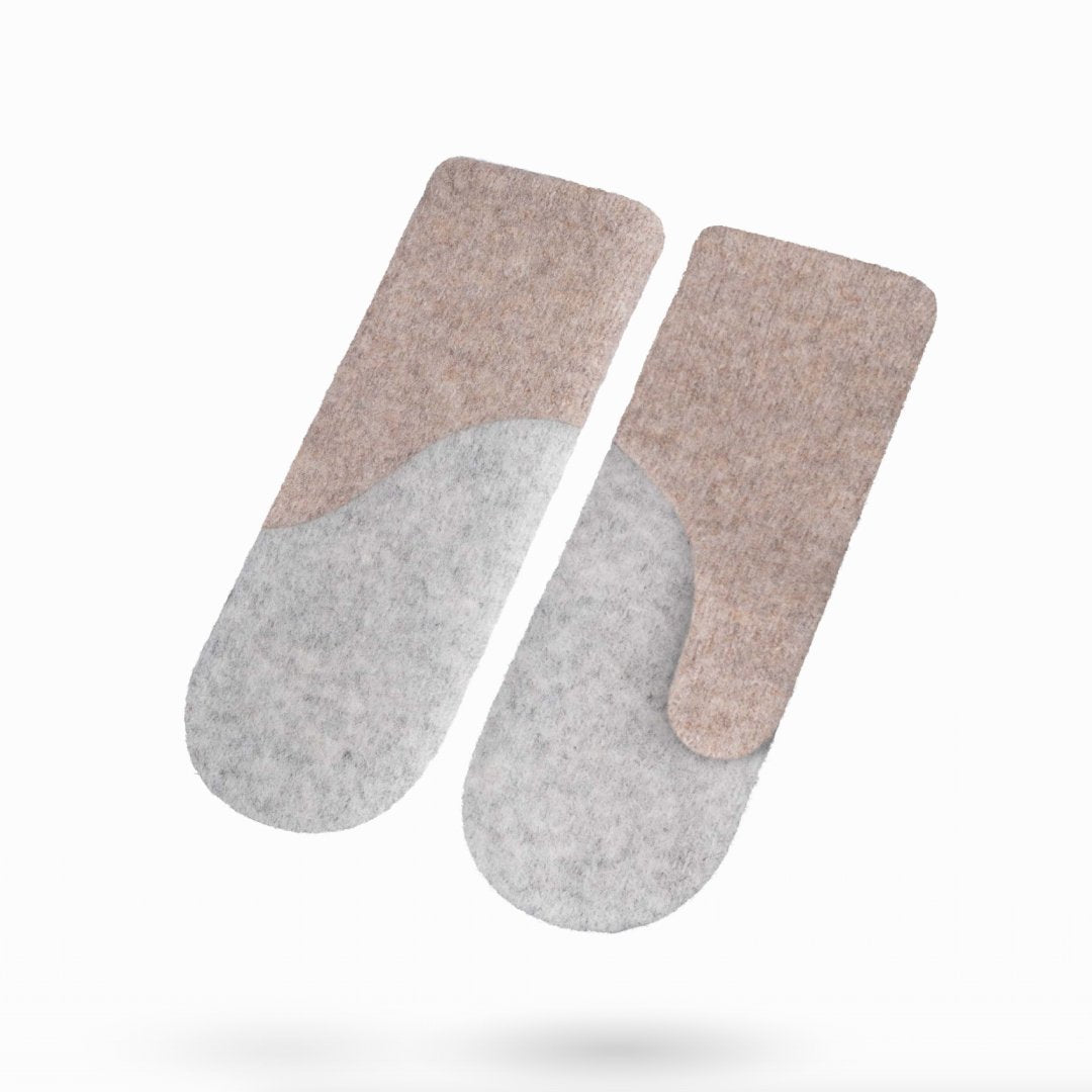 1. Studio shot of HERTTA felted wool mittens in beige and lightest grey, showcasing the two-tone design