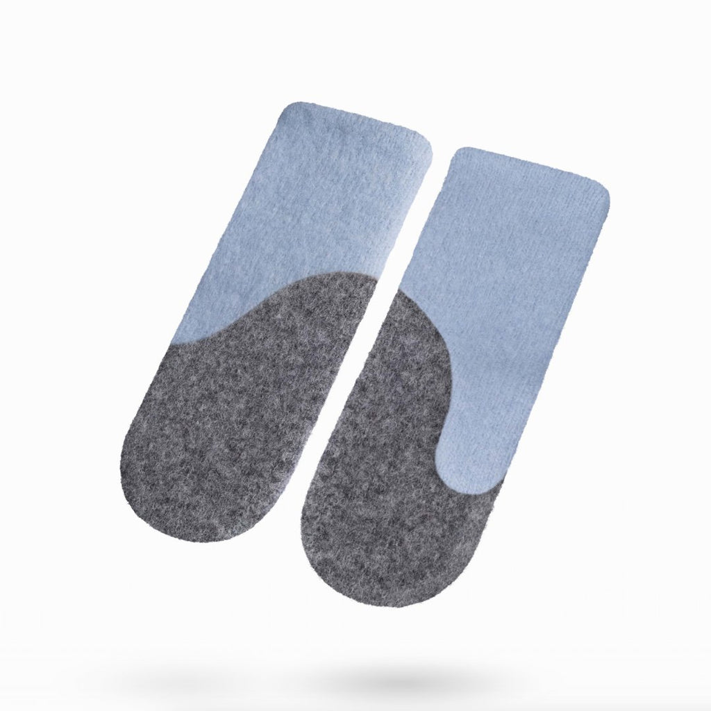 1. Studio image of HERTTA felted wool mittens in light blue and medium grey, showcasing design and color contrast