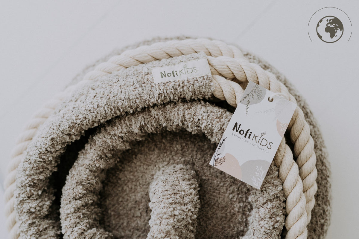 4. Detail of Nofi KIDS label on bouclé sand swing with cotton rope and tag