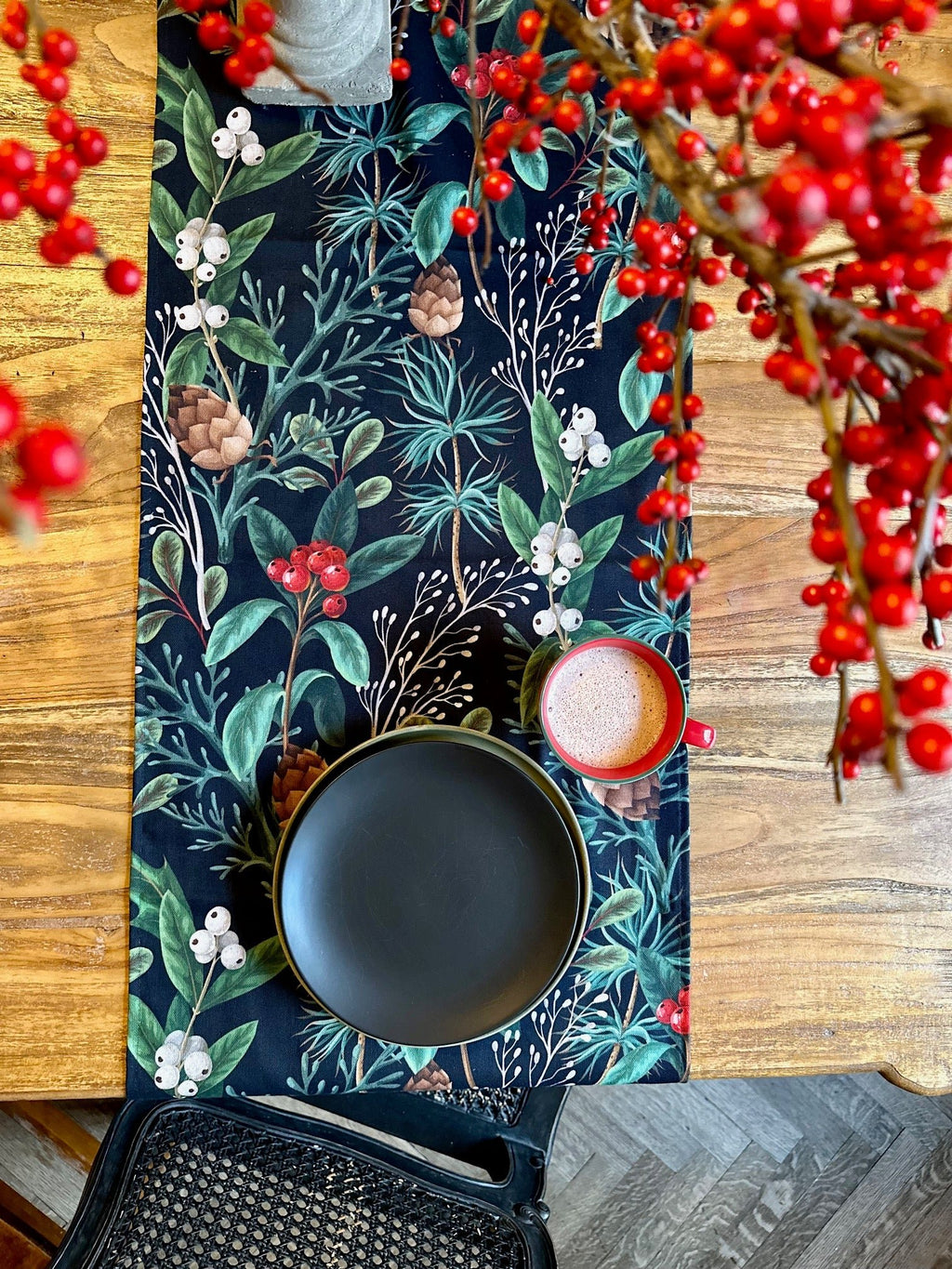 3. Christmas Forest Table Runner styled with black plate and red mug on wooden table