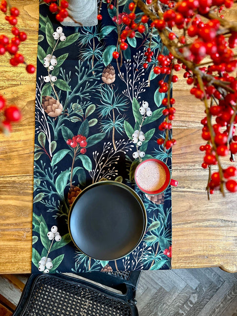 3. Christmas Forest Table Runner styled with black plate and red mug on wooden table