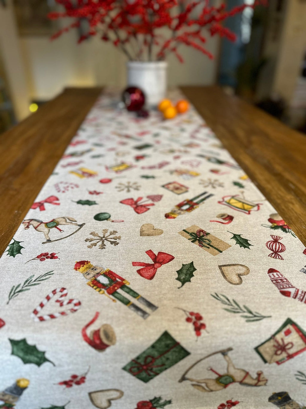 3. Christmas Story Table Runner by Hortensias Home displayed on dining table with holiday decor