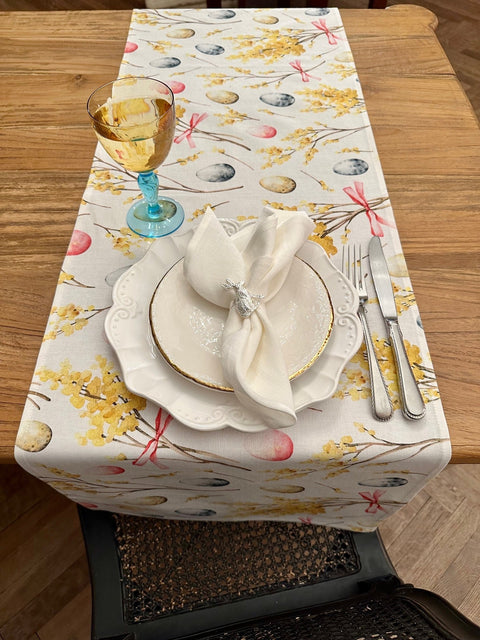 2. Close-up of Easter Happy table runner by Hortensias Home with elegant table setting, showcasing festive egg and floral design