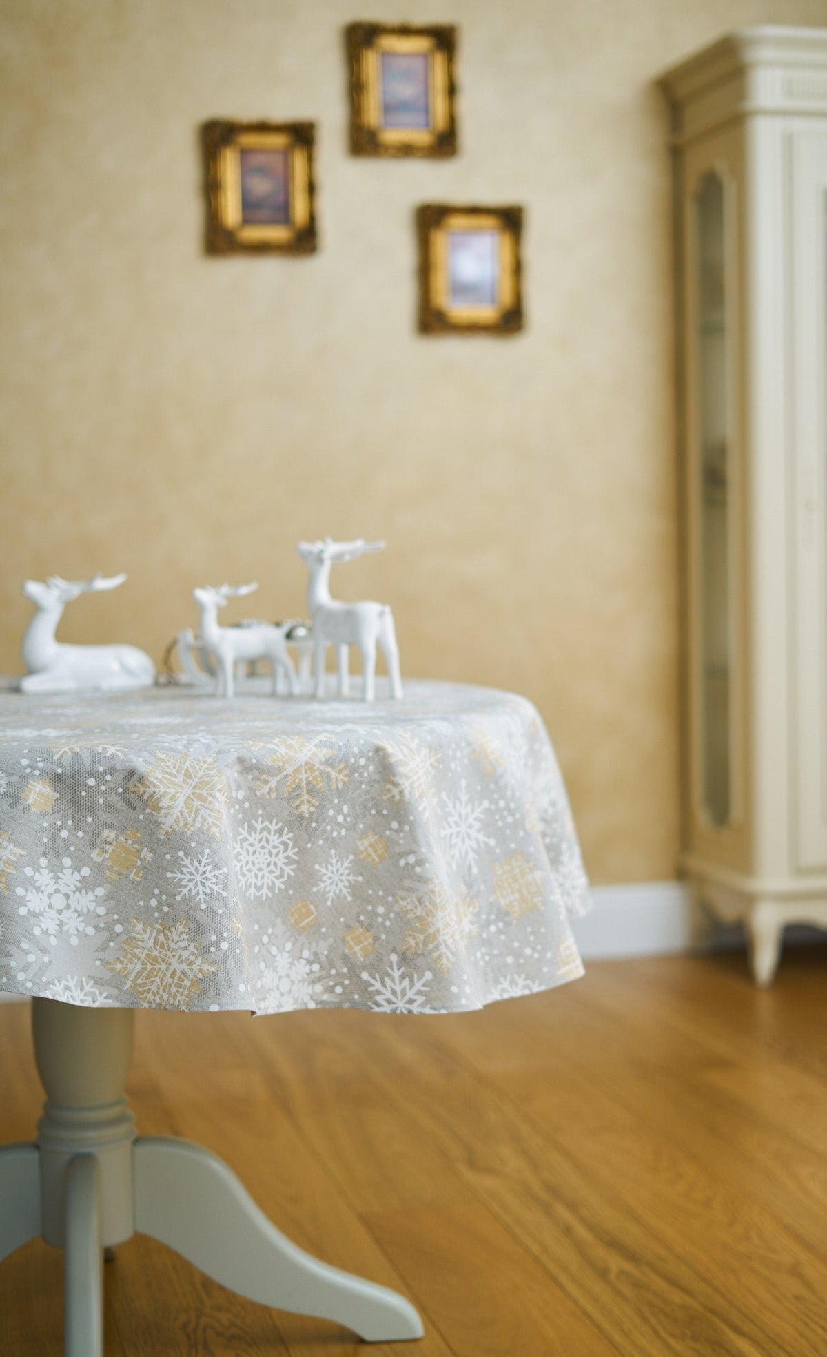 4. Hortensias Home snowflake tablecloth in elegant dining room setting with reindeer decor
