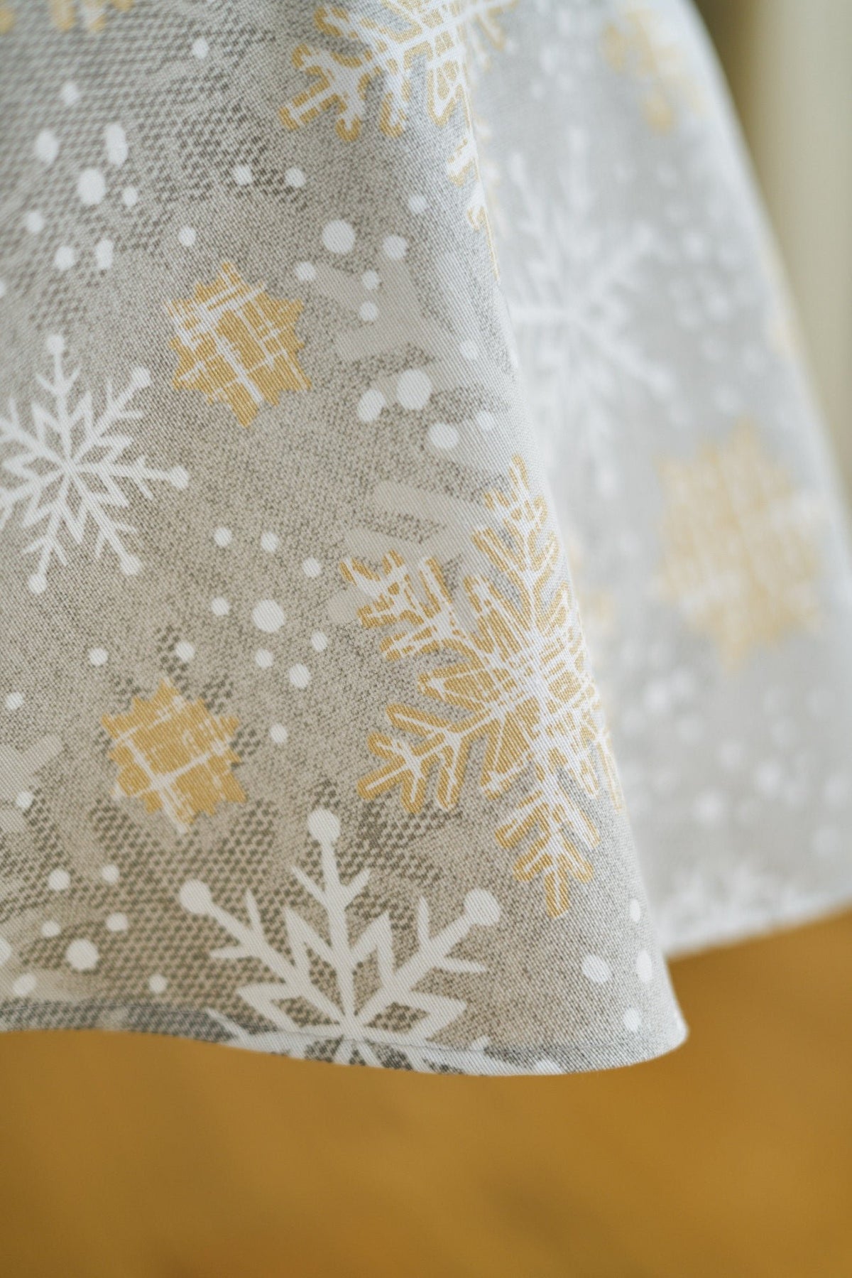 3. Close-up of gold and grey snowflake pattern on Hortensias Home Christmas tablecloth