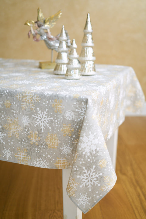 2. Close-up of Hortensias Home Winter Motive Snowflakes tablecloth showcasing elegant snowflake design in grey and gold