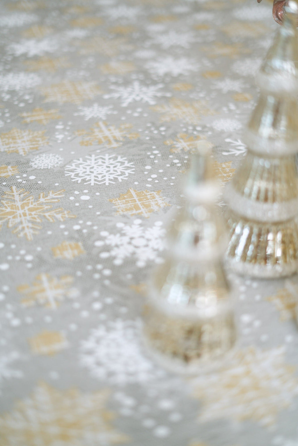 3. Detailed view of gold and grey snowflake pattern on Hortensias Home Winter Motive tablecloth