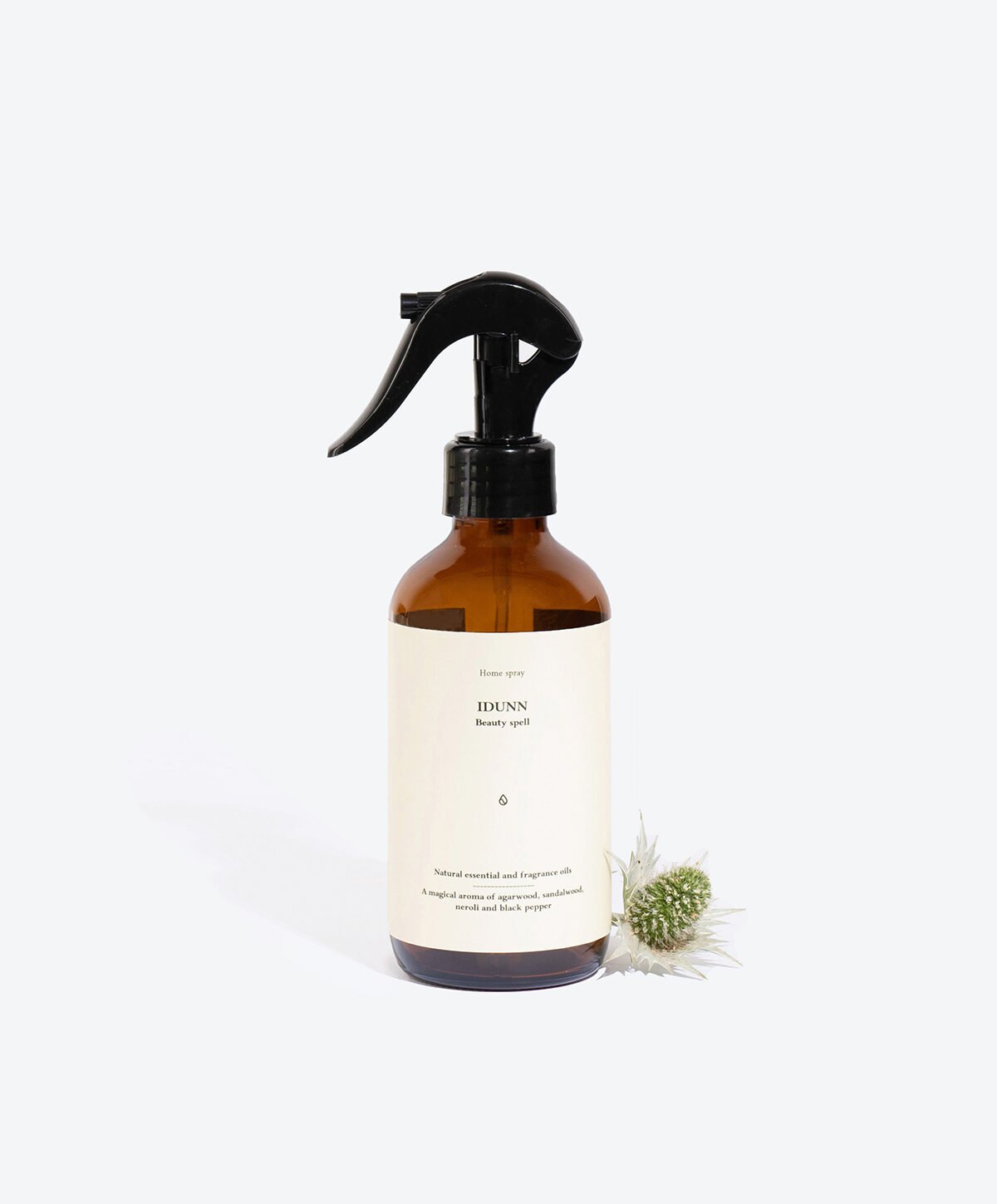 1. Smells Like Spells IDUNN perfumed home spray in amber bottle with floral accent, studio setting