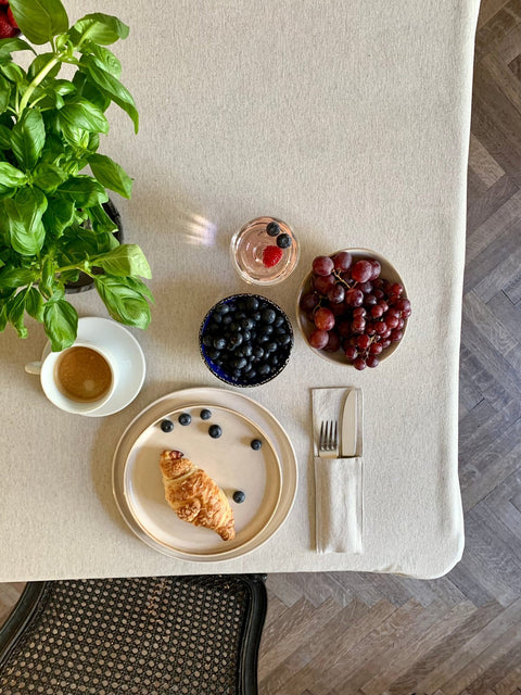 1. Rectangular tablecloth from Nord 3 collection by Hortensias Home, styled with breakfast setting, showcasing eco-friendly design in neutral color