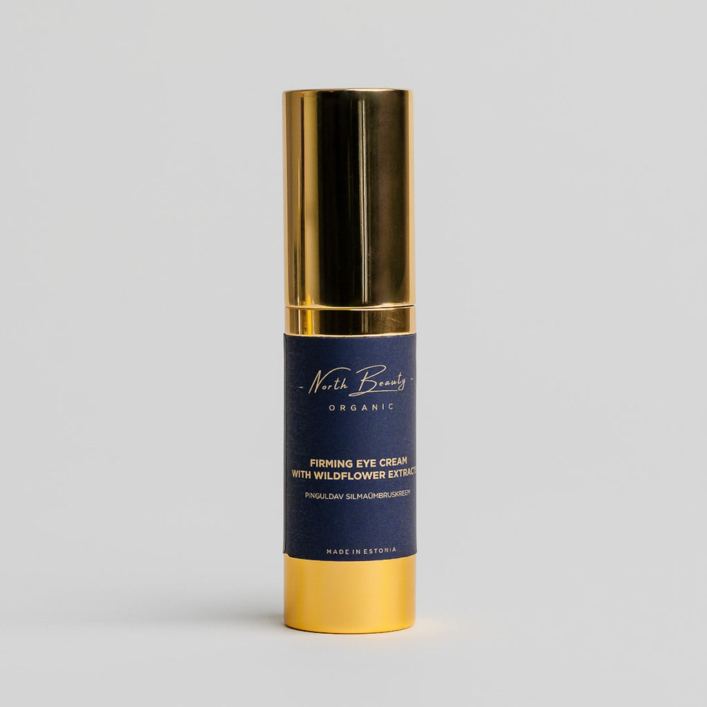 2. North Beauty firming eye cream with wildflower extracts in gold and navy packaging, studio shot