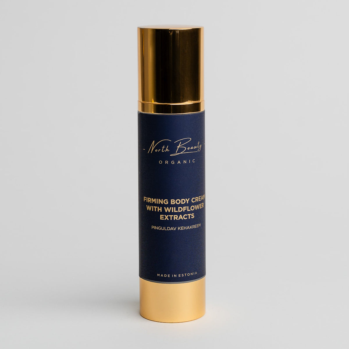 3. Studio shot of North Beauty Firming Body Cream with Hyaluronic Acid and Flower Extracts, featuring sleek gold and navy packaging