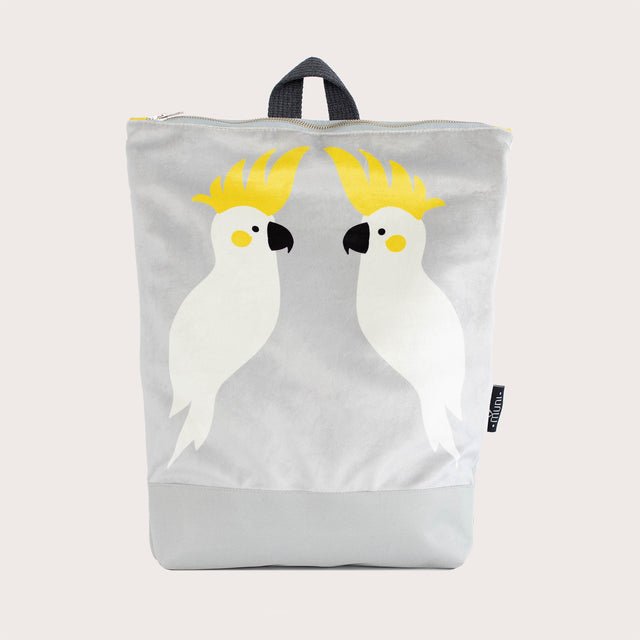 8. Studio image of Muni Cockatoo backpack in grey velvet with cockatoo design, showing full front view