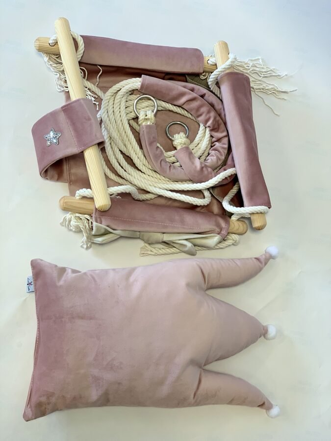 4. Flat lay of dusty pink velvet swing with crown cushion, cotton ropes, and metal rings
