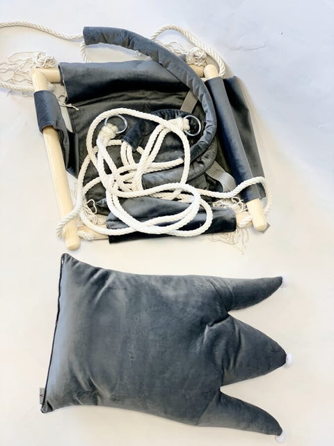 2. Disassembled grey crown-shaped cushion swing with velvet plush material, pinewood parts, and cotton ropes laid out on a white surface