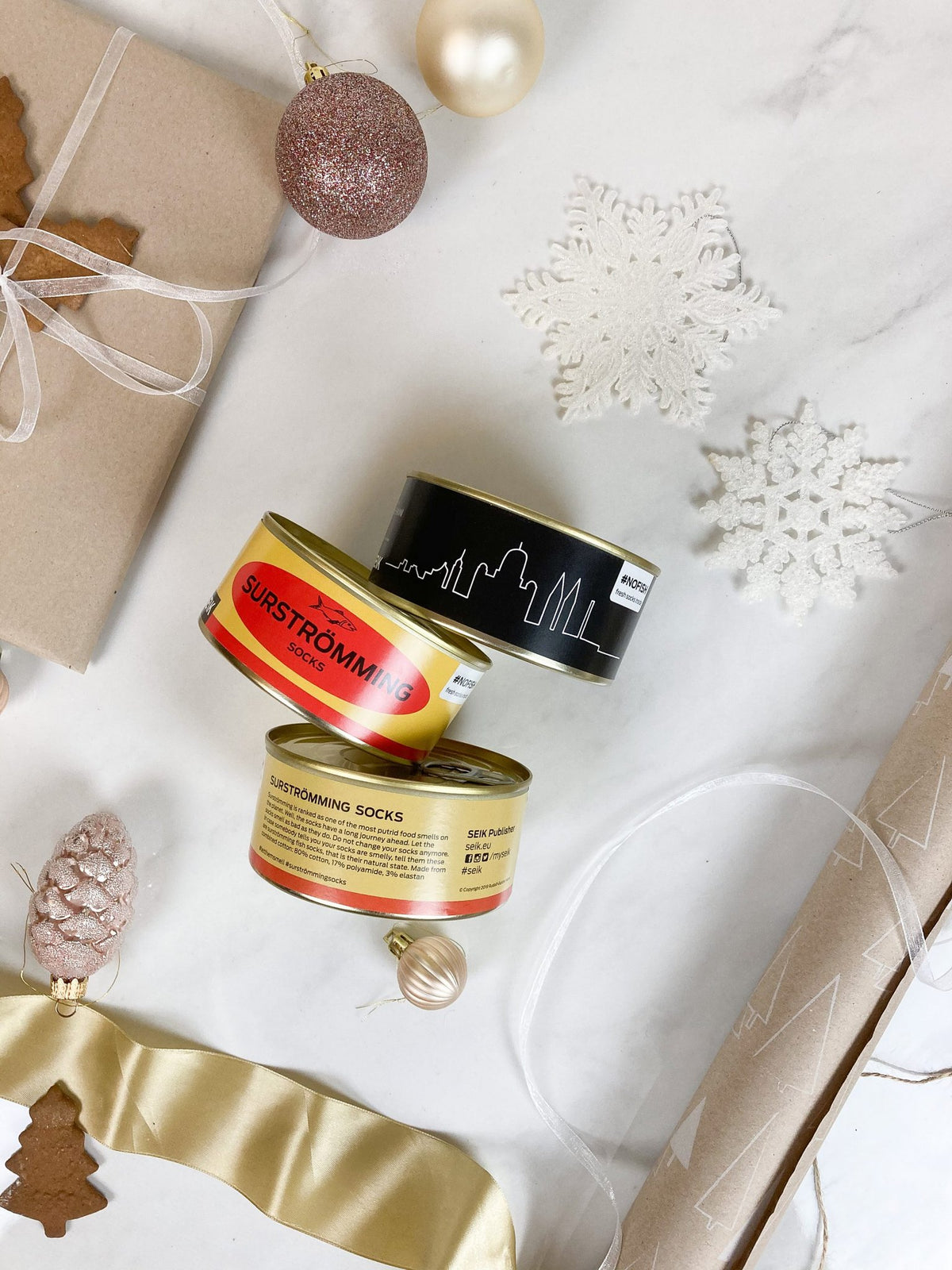 1. SEIK Socks in a Tin Can Gift Set for men and women, featuring Surströmming and Tallinn designs, displayed with festive decorations