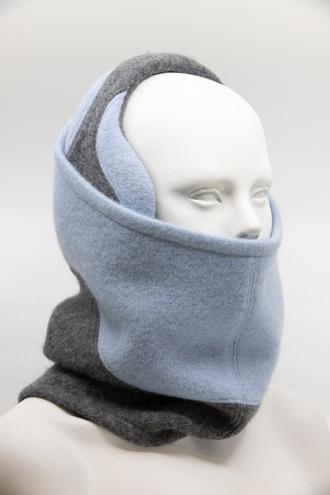 1. Unisex felted wool tube scarf in medium grey and light blue by HERTTA, worn by mannequin in studio setting