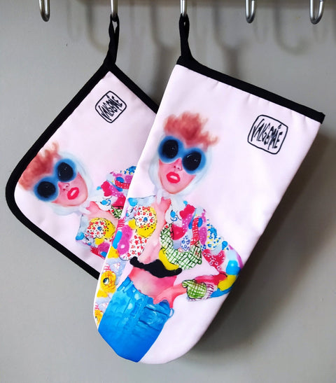 4. Set of pot holder and oven mitt with colorful pop art design by Katrin Valgemäe hanging on hooks