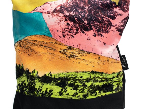 7. Close-up of Muni Bold Mountains backpack showing vibrant mountain design