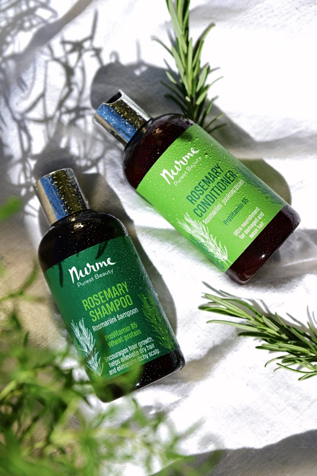 1. Nurme Rosemary shampoo and conditioner set with natural ingredients, shown with rosemary sprigs