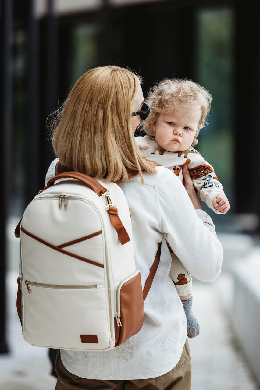7. Studio image of two Ally Scandic Cappuccino Diaper Backpacks, front and side view