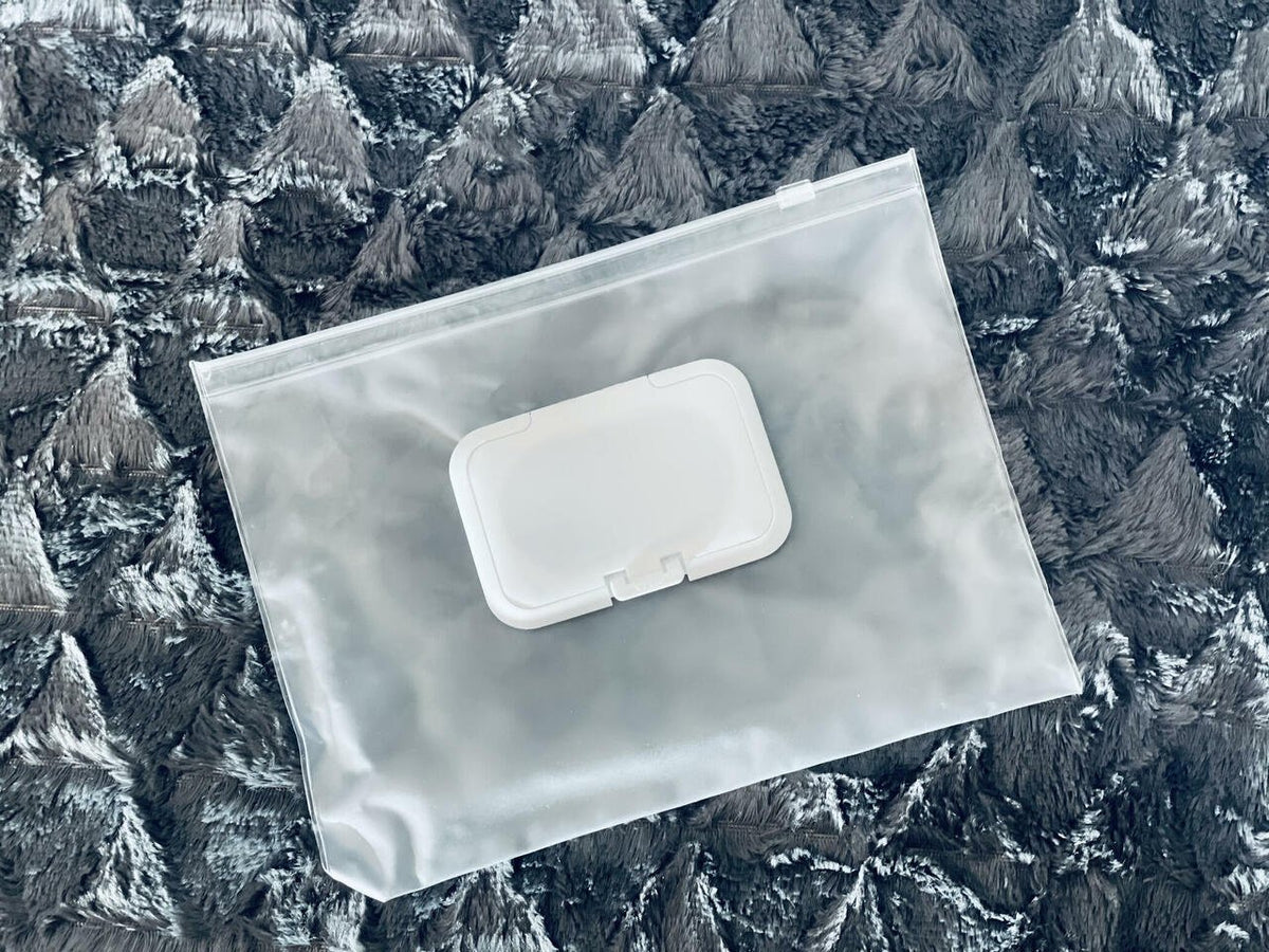 8. Flat lay of removable wet wipes pocket for Ally Scandic handbag, highlighting practical accessory for parents