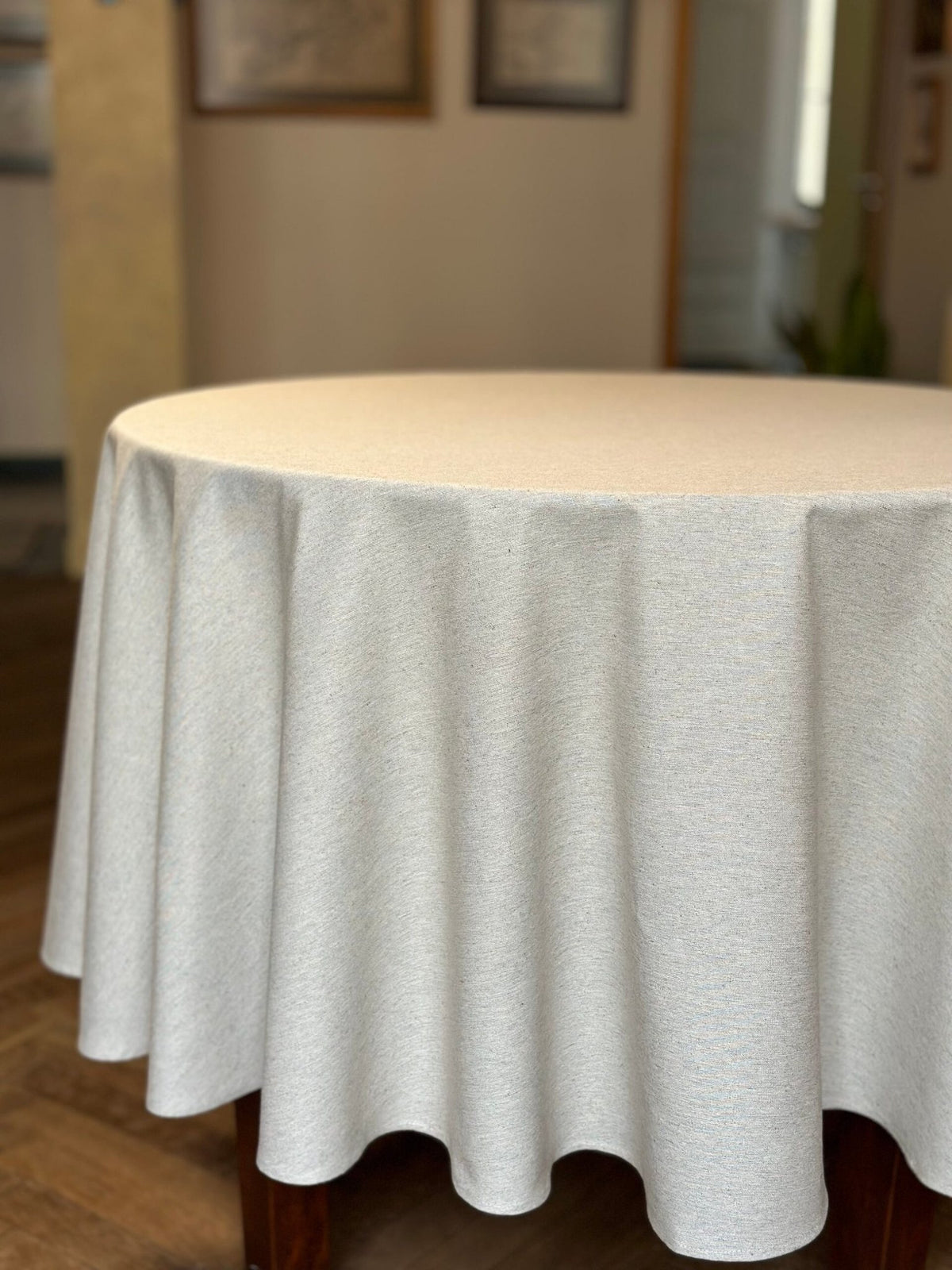 4. Round table with Hortensias Home tablecloth in a cozy setting, featuring Nordic country vibe