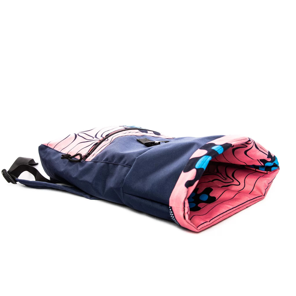 2. Side view of Drinbags PINK waterproof backpack showing roll-top closure and pink interior