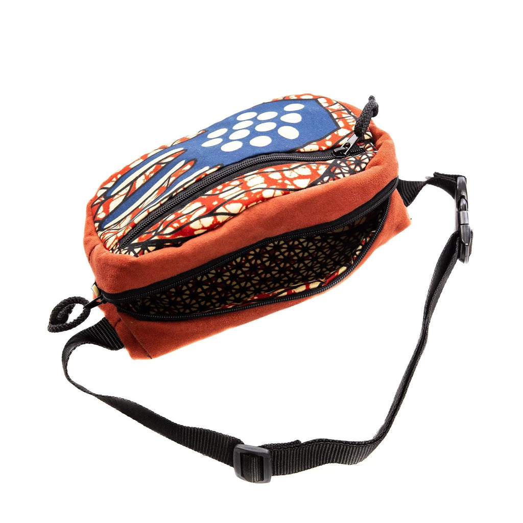 2. Side view of Drinbags HAND waist bag with adjustable strap and open main section, showcasing colorful design