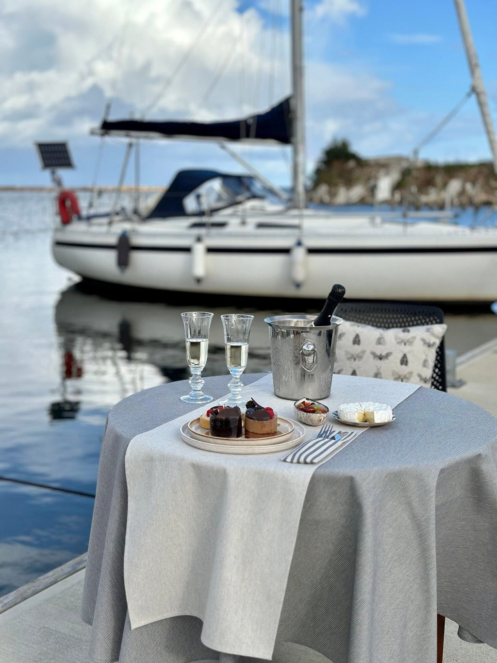 2. Elegant Nord 3 table runner by Hortensias Home on table with desserts and champagne, set by a sailboat