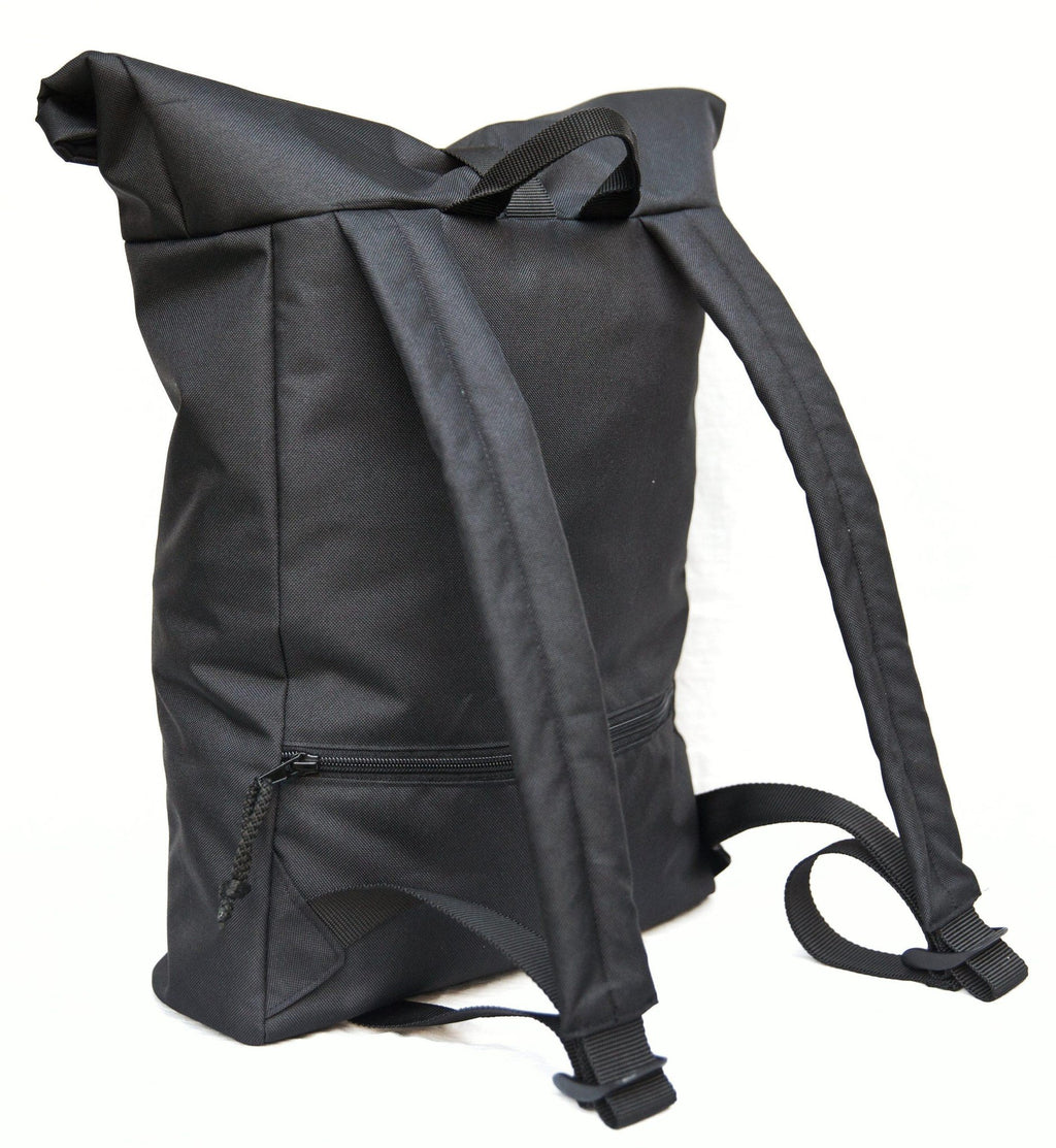 5. Back view of Drinbags PAINT waterproof backpack in black, highlighting padded shoulder straps and back pocket, studio shot