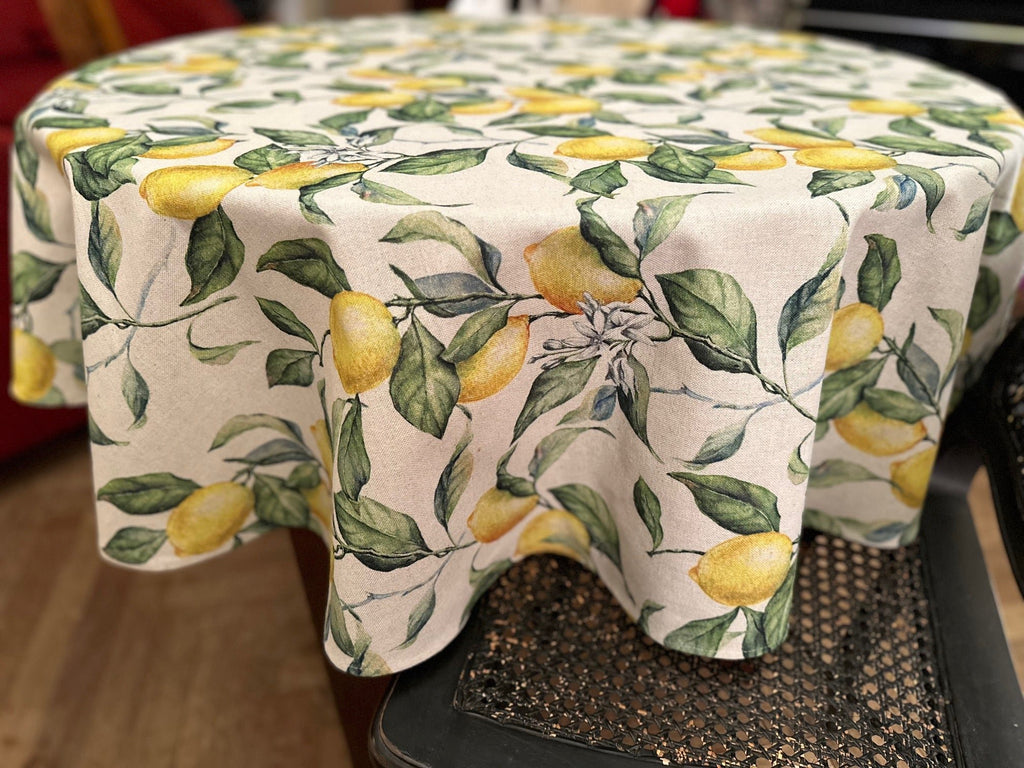 3. Close-up of Hortensias Home Lemon Linen round tablecloth highlighting detailed lemon and leaf design
