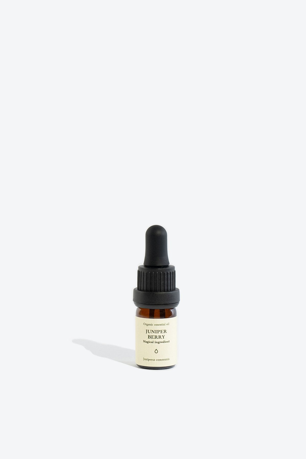 2. Smells Like Spells JUNIPER BERRY essential oil in 5 ml glass bottle with pipette, studio setting