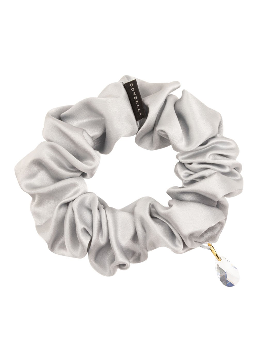 2. Studio image of Dondella luxury silk scrunchie in silver with crystal embellishment, showcasing premium Mulberry silk material