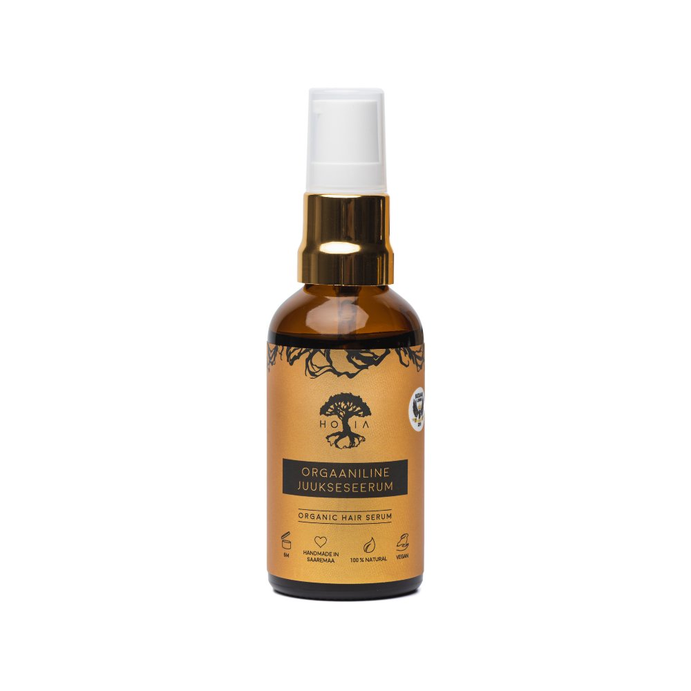 1. HOIA homespa organic hair serum bottle with black cumin oil, shown in studio setting