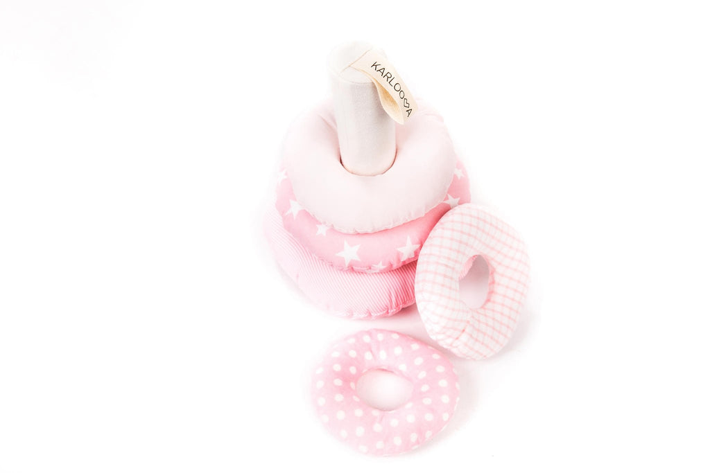 2. Pink Karloova stacking tower with rings laid flat showing various patterns