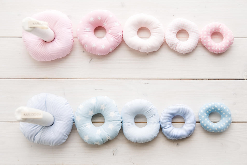 4. Flat lay of blue and pink Karloova stacking rings with various patterns