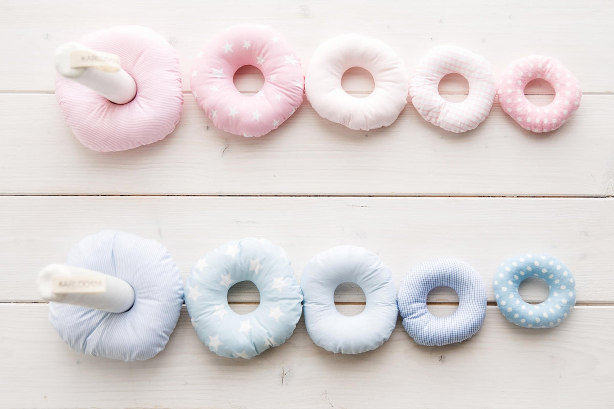 4. Flat lay of blue and pink Karloova stacking rings with various patterns