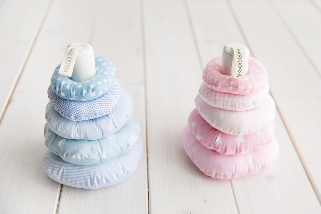 1. Blue and pink Karloova stacking towers with rings on white wooden floor