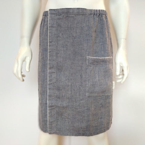 2. Front view of men's grayish blue linen sauna skirt with pocket and fishbone pattern on mannequin