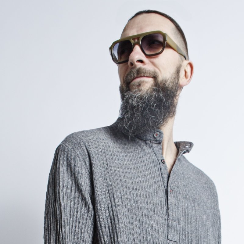 5. Close-up of man wearing KOOSdisain black and gray fishbone pattern dress, showing collar and upper chest